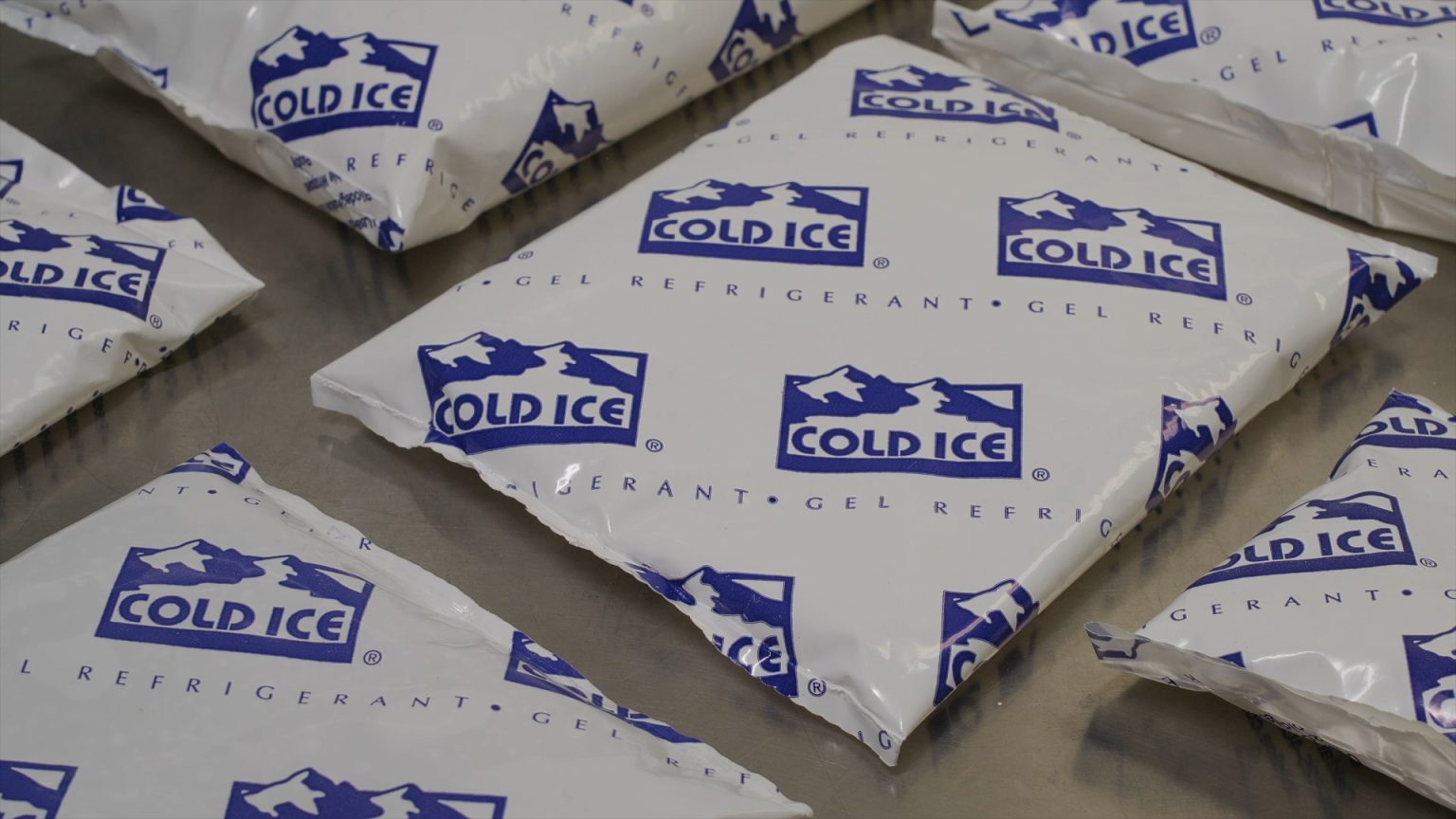 Multiple Cold Ice gel refrigerant packs stacked together.